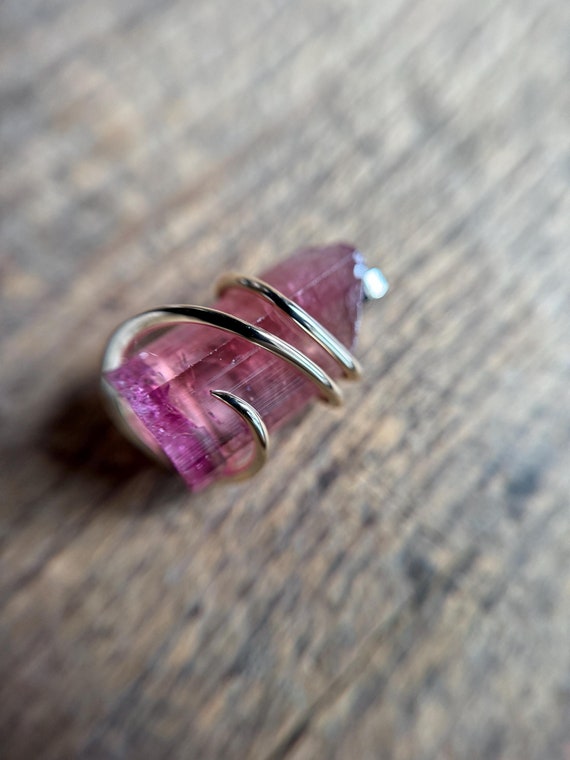 Pink tourmaline crystal in 14k gold pendant