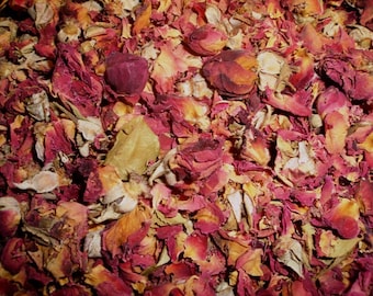 May include: A close-up shot of dried rose petals and buds. The petals display a range of colors, including deep reds, pinks, and faded yellows. The texture is varied, with some petals appearing whole and others fragmented. The overall effect is a natural, organic arrangement.