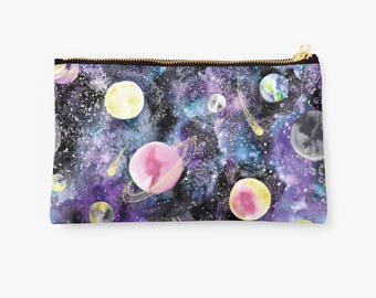 May include: A black zippered pouch with a watercolor print of planets and stars on a purple and blue background.