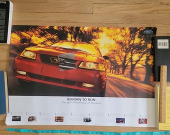 May include: A red Ford Mustang poster celebrating the 35th anniversary of the car. The poster features a red Mustang driving down a road with trees on either side. The text "REBORN TO RUN" and "The 35th Anniversary of Mustang" is at the bottom of the poster.