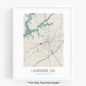 May include: A framed map print of LaGrange, Georgia, with a white border. The map features teal blue water features and a beige background. The text "LAGRANGE, GA" and coordinates are at the bottom. The text "Print Only, Frame Not Included" is at the bottom.