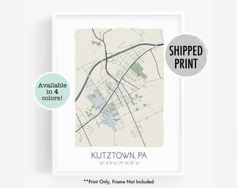 May include: A printable map of Kutztown, Pennsylvania, with a beige background and blue roads. The map shows the town's streets and landmarks. The text "Kutztown, PA" and "40° 31' 8" N / 75° 46' 35" W" is printed below the map. The text "Print Only, Frame Not Included" is printed below the coordinates. The text "SHIPPED PRINT" is printed in a gray circle in the upper right corner of the map.