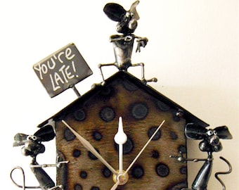 Reloj de péndulo de ratón que te recuerda que &quot;¡Llegas tarde!&quot;