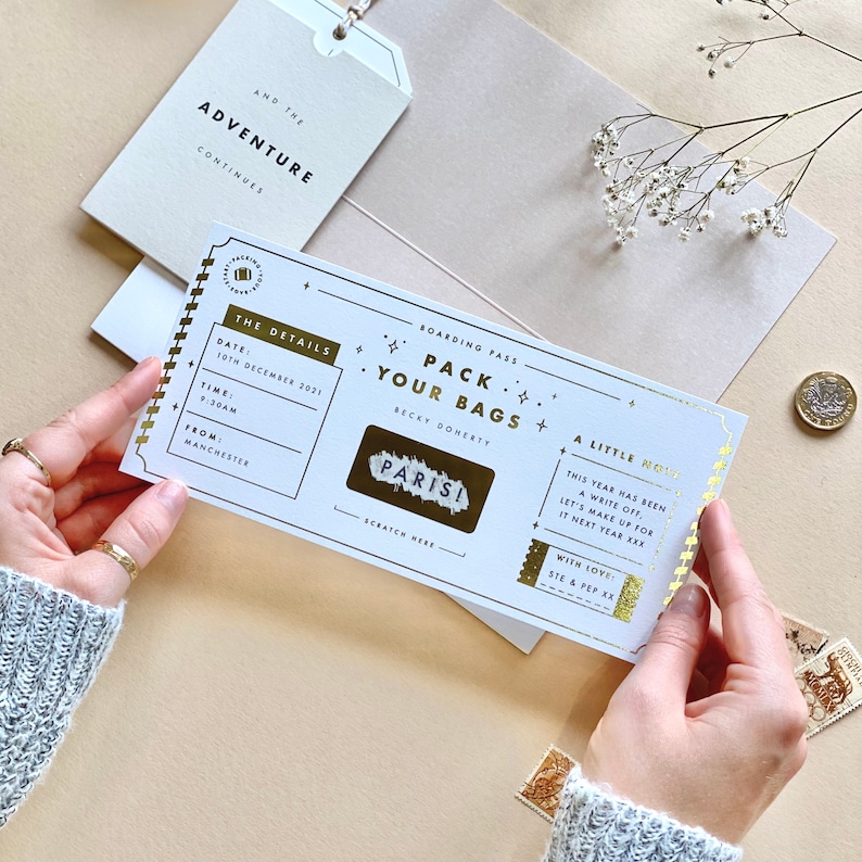 Lux Travel Scratch Card Announcement Boarding pass, with gold foil. Here we see the personalised wallet and boarding pass. With a meal telegram and little extra card in the wallet. Designed by Rodo Creative