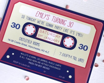 May include: A pink and blue cassette tape-themed party invitation for a 30th birthday party. The invitation says "Emily's Turning 30" and "So tonight we're gonna party like it's 1985!" The party is on Saturday, January 31st at 7:00pm at Castlefield Rooms, 18-20 Castle Street, Manchester, M3 4LZ. The invitation encourages guests to wear mullets, perms, leg warmers, muscle shirts, and neon clothing. There are prizes for best dressed.