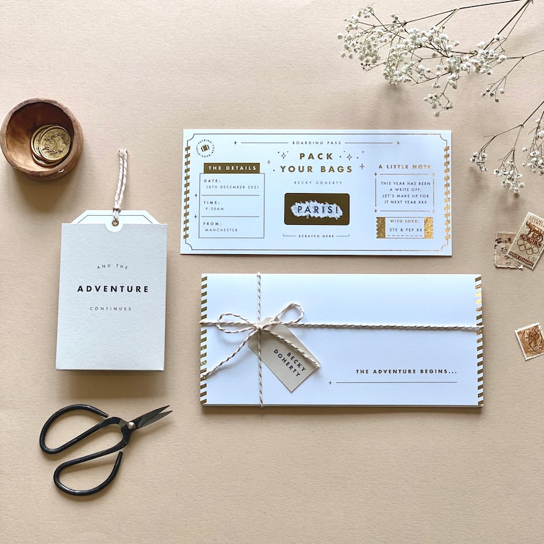 Lux Travel Scratch Card Announcement Boarding pass, with gold foil. Here we see the personalised wallet and boarding pass. With a meal telegram and little extra card in the wallet. Designed by Rodo Creative