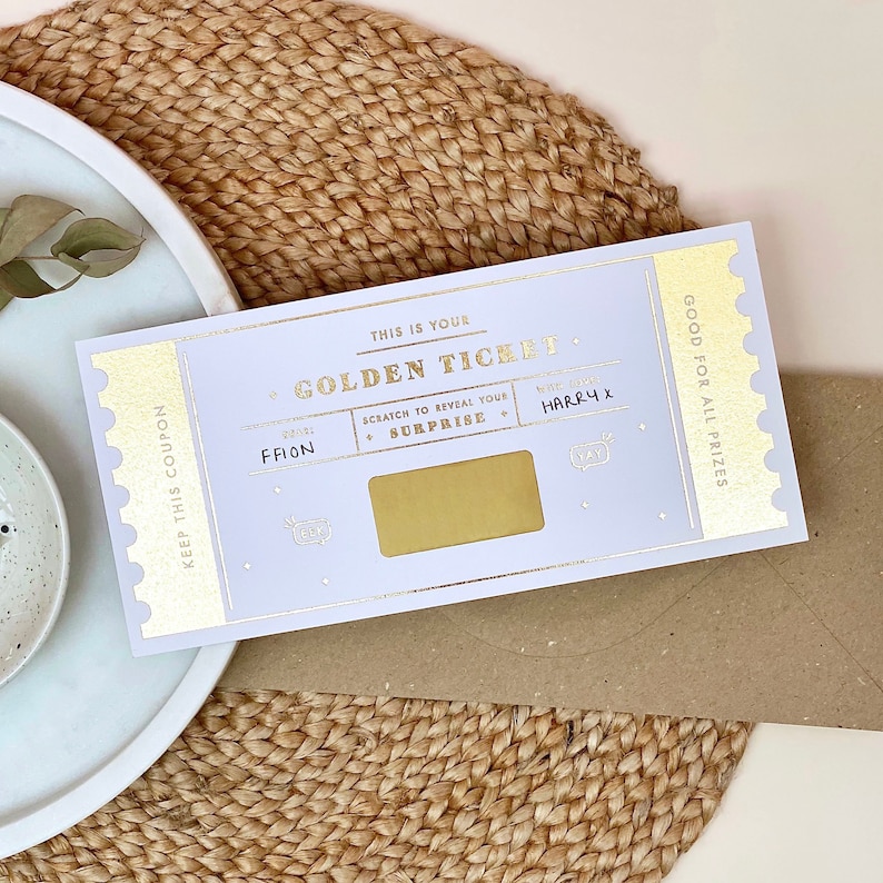 Handwritten ticket surprise. This high-quality golden ticket features gold metallic foil, a fun and exciting scratch card feature and a beautiful creative design. This DL sized ticket gift will announce the gift in an exciting way.