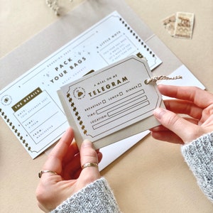 Lux Travel Scratch Card Announcement Boarding pass, with gold foil. Here we see the personalised wallet and boarding pass. With a meal telegram and little extra card in the wallet. Designed by Rodo Creative