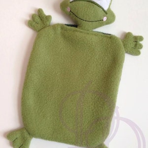 May include: Green plush frog-shaped hot water bottle with embroidered eyes and a smiling mouth.