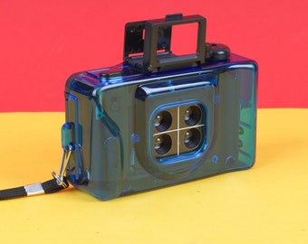 P&S 35mm film camera with 4 lenses. Plastic Fantastic! Great for lomography. NEW, unused blue point and shoot camera with four lenses!