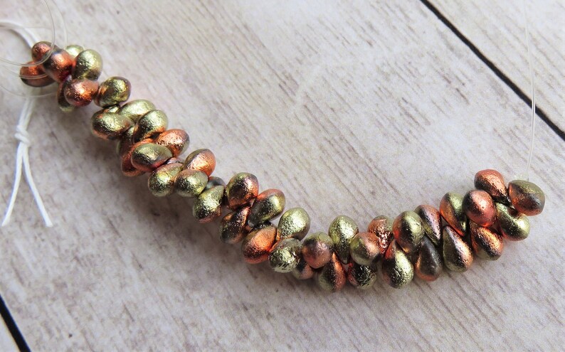 Item 6999 California Gold Etched Czech Teardrop 4 by 6 mm Beads 50 Beads