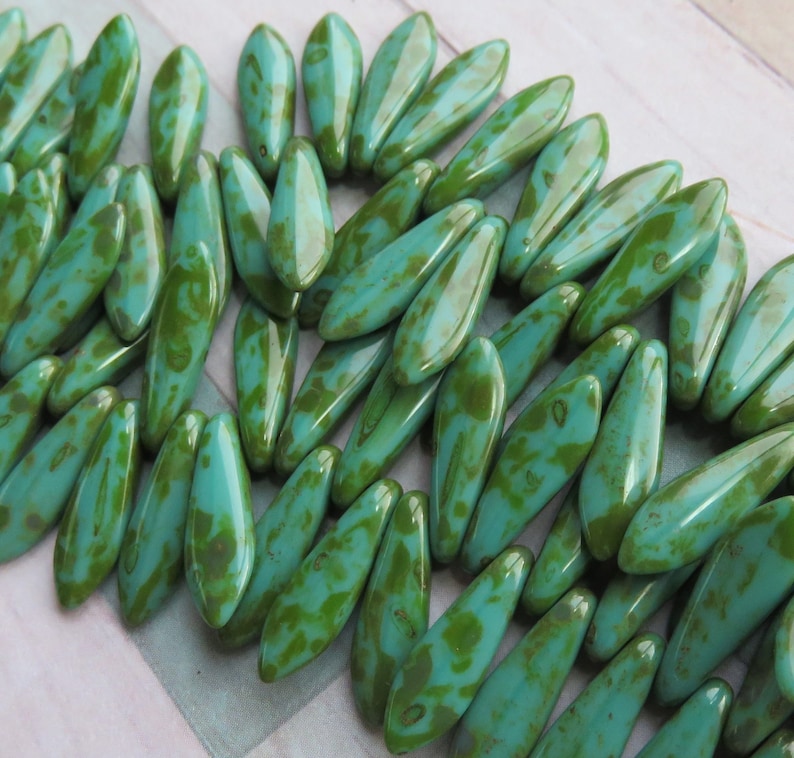 Green Turquoise with Full Picasso Coating Dagger 5 mm by 16 mm Czech Beads 25 beads Item 6877