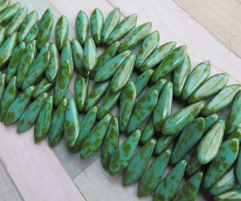 Green Turquoise with Full Picasso Coating Dagger 5 mm by 16 mm Czech Beads 25 beads Item 6877