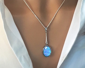 Long Blue Opal Pendant Necklace, Oval Cabochon Opal, set in 925 Sterling Silver, fastens at 16" and 18". Ref: AEP5002