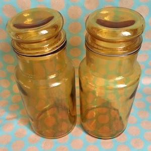 Two Glass Storage Jars