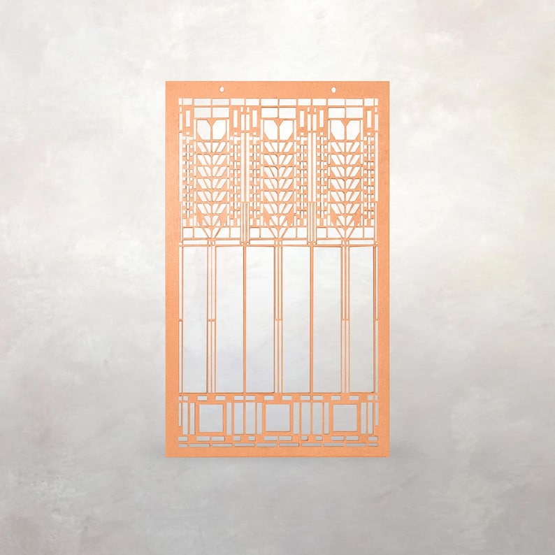 May include: An orange laser-cut architectural design, possibly a window or panel. The design features geometric patterns and vertical lines, with three small holes at the top. The style is reminiscent of Art Deco or Craftsman design.
