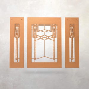 May include: Three-piece copper-colored wall art with geometric cut-out designs. The central panel features a complex pattern of hexagons and lines, flanked by two narrower panels with vertical designs. The art has a modern, architectural aesthetic.