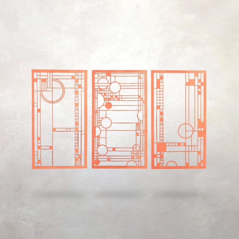 May include: Three orange geometric art panels with a mid-century modern design. Each panel features a unique arrangement of lines, circles, and rectangular shapes. The panels are displayed against a light gray background.