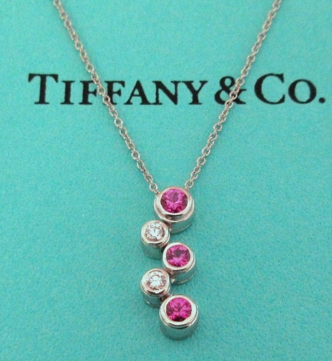 Tiffany T smile pendant in 18k white gold with pink sapphires, small. |  Tiffany & Co.