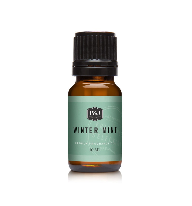 May include: A small amber glass bottle with a black cap, containing Winter Mint premium fragrance oil. The label is green with white text and a black and white logo.