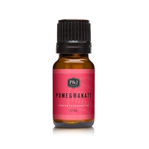 May include: A brown glass bottle with a black cap containing 10 ml of pomegranate scented fragrance oil. The label is red and white with the text "P&J Trading, Pomegranate Selection, Premium Fragrance Oil, 10 ml, Premium".