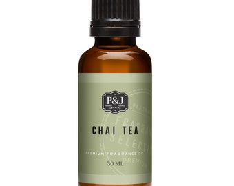 May include: A brown glass bottle with a black cap containing Chai Tea fragrance oil. The label is green with white text that reads "P&J Trading", "Fragrance Selection", "Chai Tea", "Premium Fragrance Oil", and "30 ml".