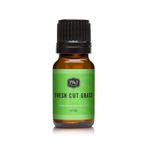 May include: A 10 ml bottle of premium fragrance oil in a brown glass bottle with a black cap. The label is green and white and says "P&J Trading" and "Fresh Cut Grass".