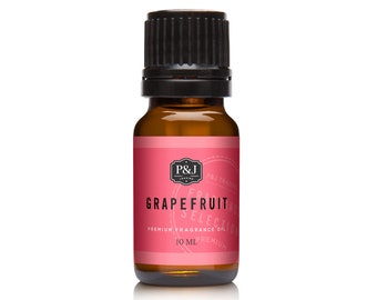 May include: A small amber glass bottle of grapefruit fragrance oil. The label is pink with the text "GRAPEFRUIT SELECTION" and "PREMIUM FRAGRANCE OIL 10 ML". The bottle has a black cap.