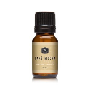 May include: A brown glass bottle with a black cap, labeled "CAFÉ MOCHA" and "PREMIUM FRAGRANCE OIL 10 ML". The label also features a black and white logo with the initials "P&J".