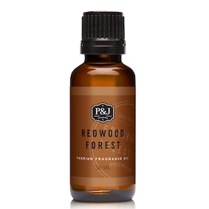 May include: A brown glass bottle with a black cap, labeled "Redwood Forest" and "Premium Fragrance Oil". The bottle contains 30 ml of oil.