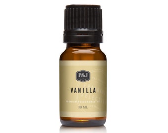 May include: A brown glass bottle with a black cap, labeled "Vanilla Premium Fragrance Oil" by P&J Fragrances. The bottle contains 10 ml of oil.