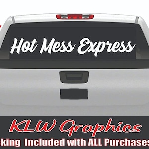 May include: White vinyl decal with the text "Hot Mess Express" in a cursive font. The decal is 46 inches wide and 5.5 inches tall. The decal is shown on the back window of a white pickup truck.