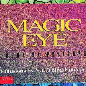 May include: A book of postcards titled "Magic Eye: A Book of Postcards" with a holographic cover featuring a purple and yellow background. The text "3D Illusions by N.E. Thing Enterprises" is printed below the title. The Scholastic logo is in the bottom left corner.