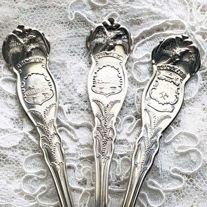 THREE SOUVENIR SILVERPLATE Vintage Spoons Eagle William Rogers & Son Colorado and Ohio Pat.feb.23.1915 and others