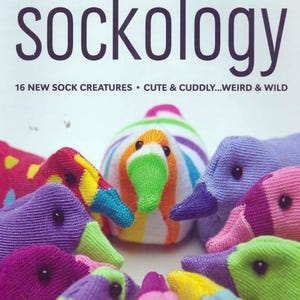 May include: A book titled "Sockology" with the subtitle "16 New Sock Creatures - Cute & Cuddly...Weird & Wild". The cover features a colorful arrangement of sock puppets shaped like ducks.