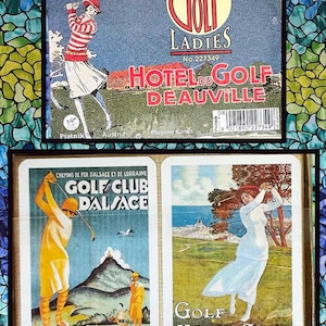 May include: Two vintage playing card decks featuring women playing golf. The first deck is titled "Golf Ladies Hotel du Golf Deauville" and the second deck is titled "Golf Club Dalsace Seles/tat Haut Koenig/bourg" and "Golf Monte-Carlo".