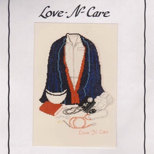 May include: Cross-stitch chart titled "Love-N-Care" from the Firefighter and Public Safety Series. The image features a cross-stitch design of a jacket, medical equipment, and the text "Love-N-Care". The chart is a needlework adaptation of an original poster.