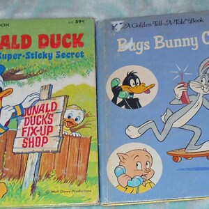 May include: Two vintage children's books. The first, "Donald Duck and the Super-Sticky Secret," features Donald Duck and the text "Donald Duck's Fix-Up Shop." The second book is titled "Bags Bunny Calling!" and features Bugs Bunny.
