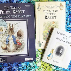 May include: A blue and white magnetic tin play set featuring The Tale of Peter Rabbit. The set includes 46 magnets, 2 play scenes, a mini storybook, and a magnetic tin play case. The set is suitable for ages 3 and up.