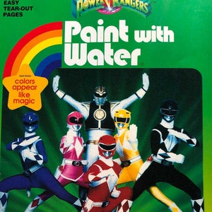 May include: A coloring book featuring the Mighty Morphin Power Rangers. The cover shows the five Power Rangers in their colorful suits, with the words "Paint with Water" in large, bold letters.