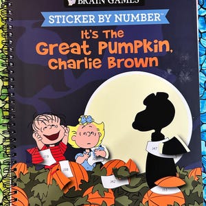 May include: A spiral-bound "Sticker by Number" activity book featuring the Peanuts characters. The cover reads "It's The Great Pumpkin, Charlie Brown" with images of Linus, Sally, and Snoopy. The background is a dark blue night sky with a full moon.