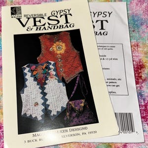 May include: Two sewing pattern booklets. The main booklet is titled "Reversible Gypsy Vest & Handbag" with images of a vest and handbag. The second booklet is titled "Gypsy Bag". The patterns feature colorful, patterned designs.