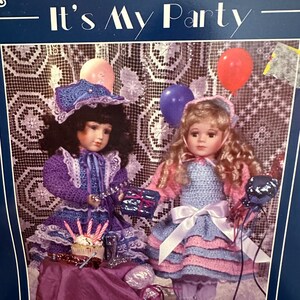May include: A crochet pattern titled "It's My Party" featuring two dolls dressed in handmade crochet outfits. One doll wears a purple dress with a matching hat, and the other wears a blue and pink dress. The pattern is designed for 18" dolls.