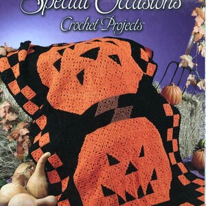 May include: A crochet pattern book titled "Annie's Favorite Special Occasions Crochet Projects" featuring a black and orange crochet pumpkin blanket.