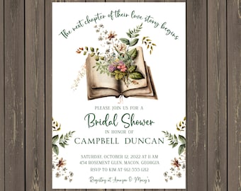 May include: A white bridal shower invitation with green floral accents and a vintage book illustration. The text reads "The next chapter of their love story begins."  "Please join us for a Bridal Shower in honor of Campbell Duncan."  "Saturday, October 12, 2022 at 11 AM 454 Rosement Glen, Macon, Georgia RSVP to Kim at 912-555-1212 Registry at Amazon & Macy's"