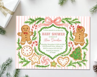 May include: A baby shower invitation with a pink and white striped design. The card features gingerbread people, candy canes, and cookies. The text announces a baby shower and includes event details.