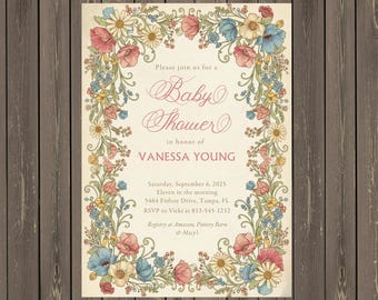 May include: Baby shower invitation with floral border. The invitation features the text "Baby Shower" in elegant script, along with the name "VANESSA YOUNG". The floral border includes pink, blue, and yellow flowers.