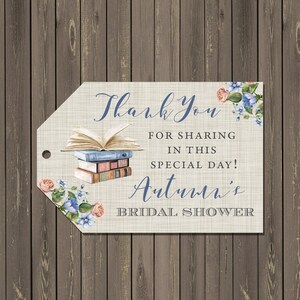 May include: A thank you tag for a bridal shower with a stack of books, flowers, and the text "Thank you for sharing in this special day! Autumn's Bridal Shower".