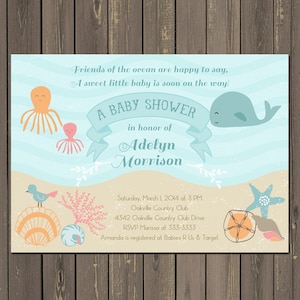 May include: A baby shower invitation with an ocean theme. The invitation features a whale, octopus, and seashells. The text reads "A Baby Shower in honor of Adelyn Morrison". The date, time, and location of the shower are also included.