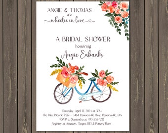 May include: A bridal shower invitation with a watercolor illustration of a blue bicycle with a basket of flowers. The text reads "Angie & Thomas are wheelie in love" and "A Bridal Shower honoring Angie Eubanks".